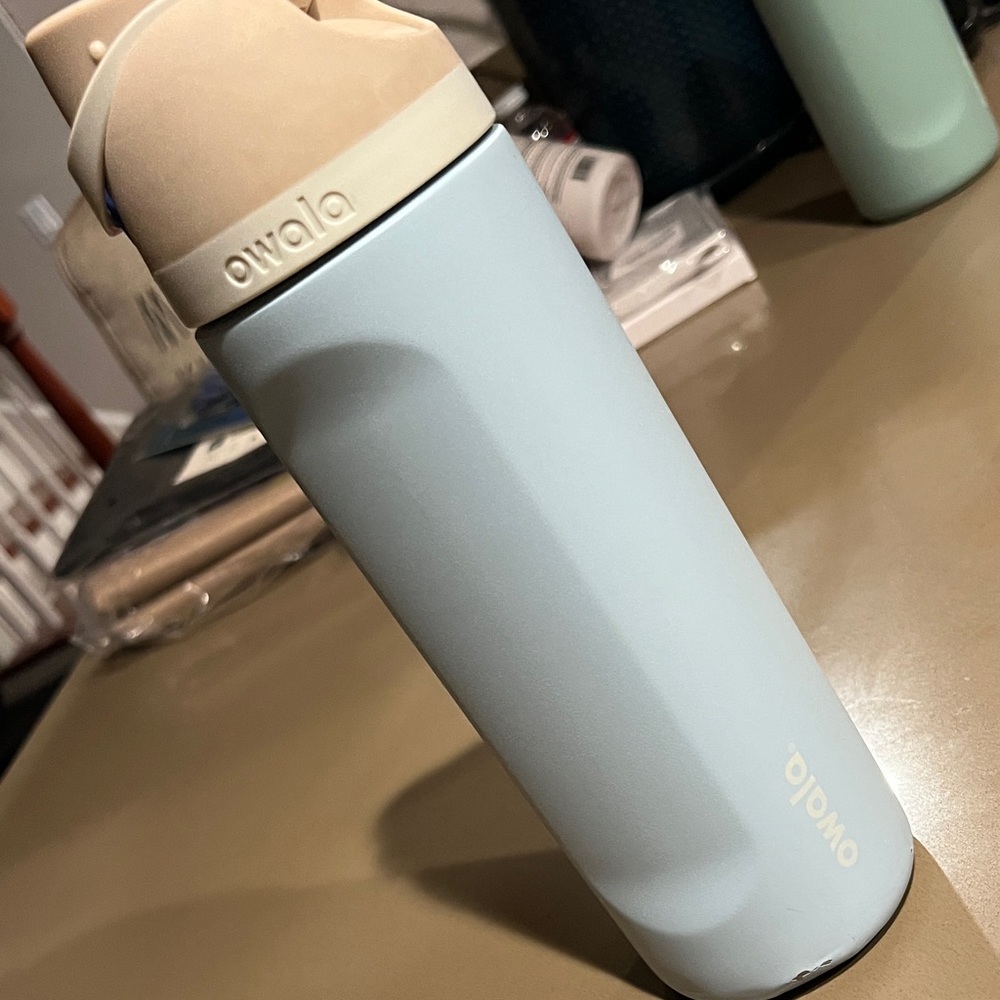 Owala Light Blue and Beige Water Bottle